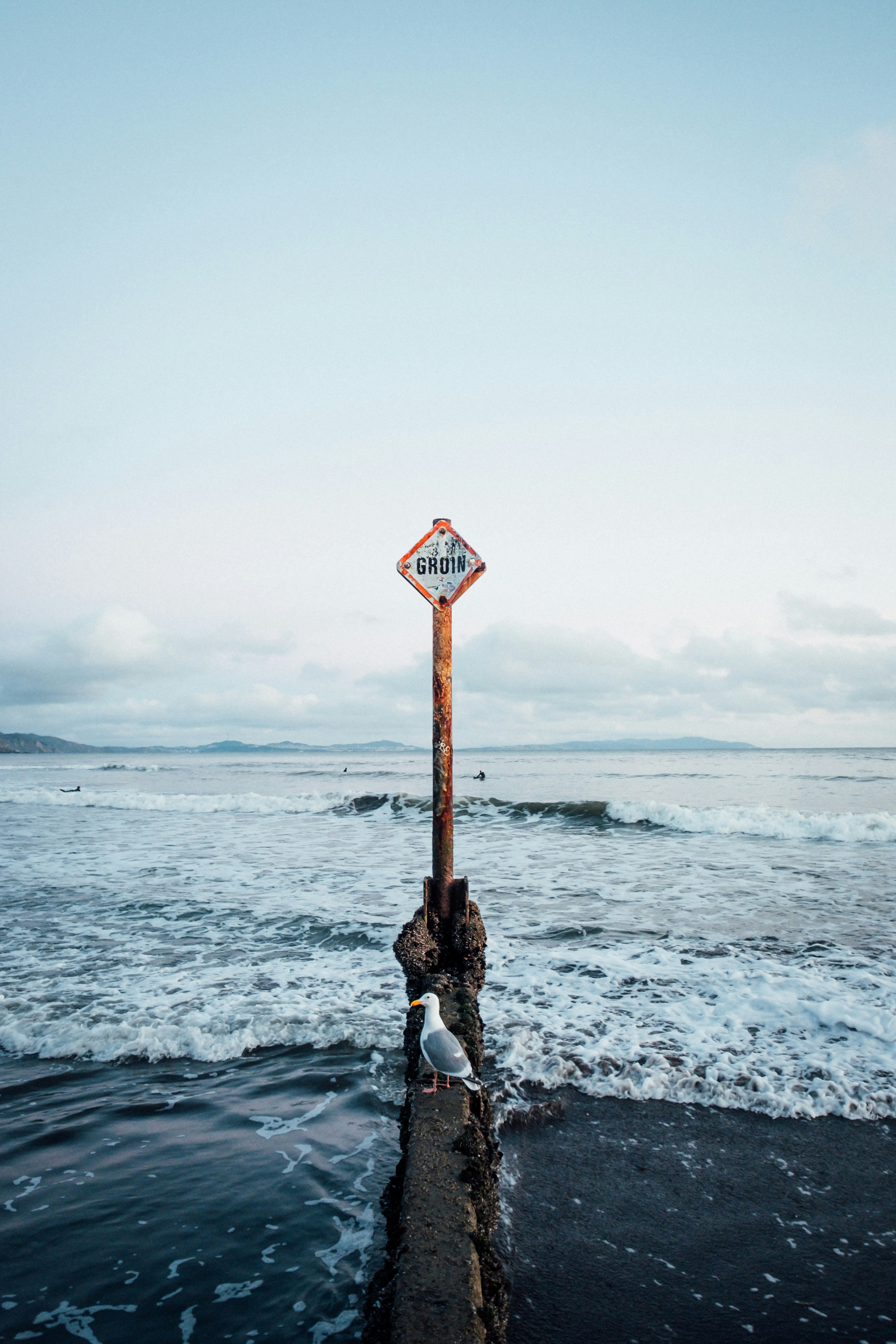 signage upright on sea